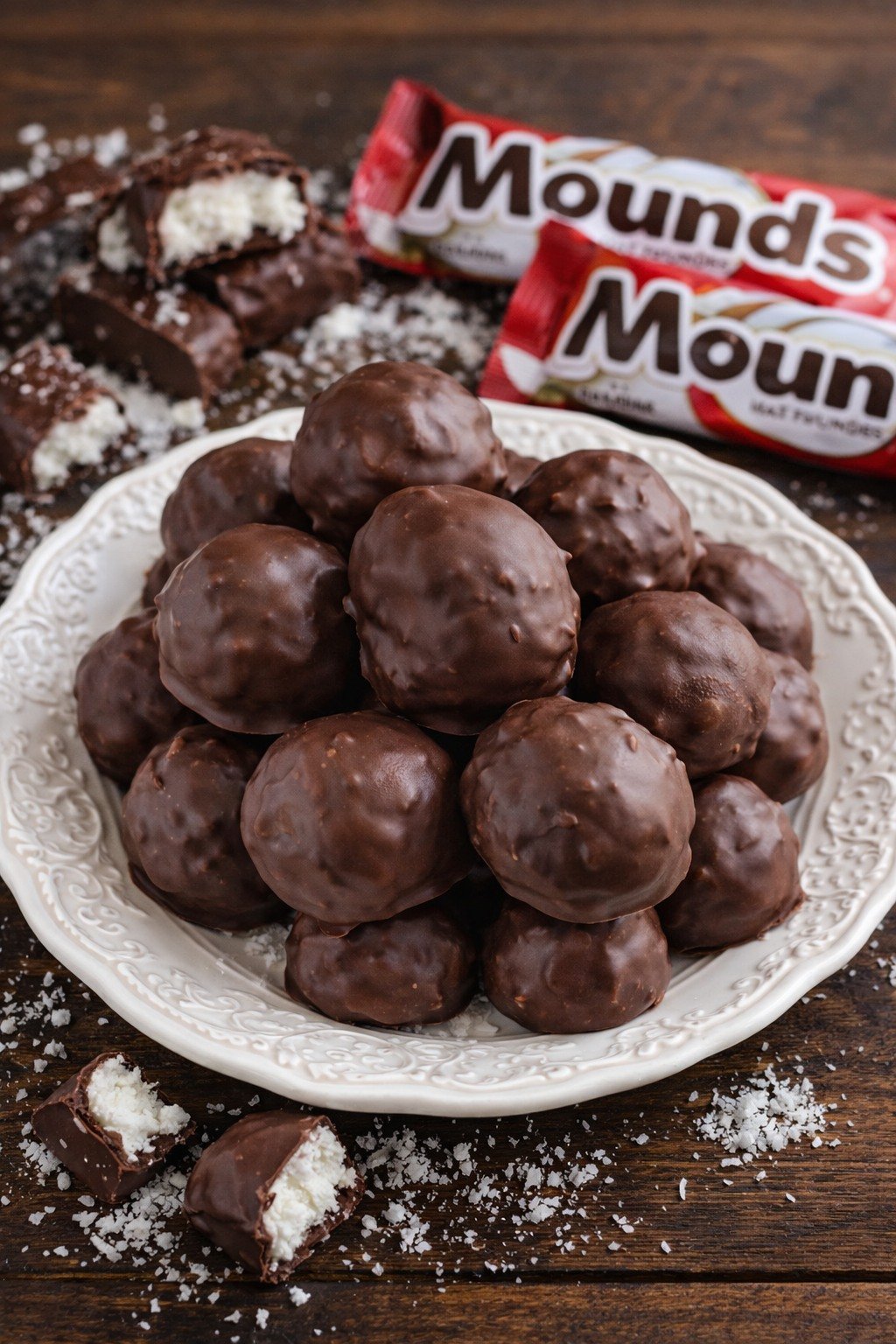 Mounds Coconut Copycat Chocolate Balls on a white pretty plate 