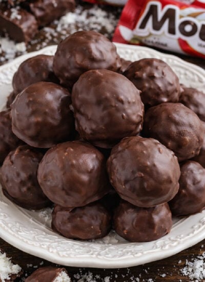 Mounds Coconut Copycat Chocolate Balls on a white pretty plate