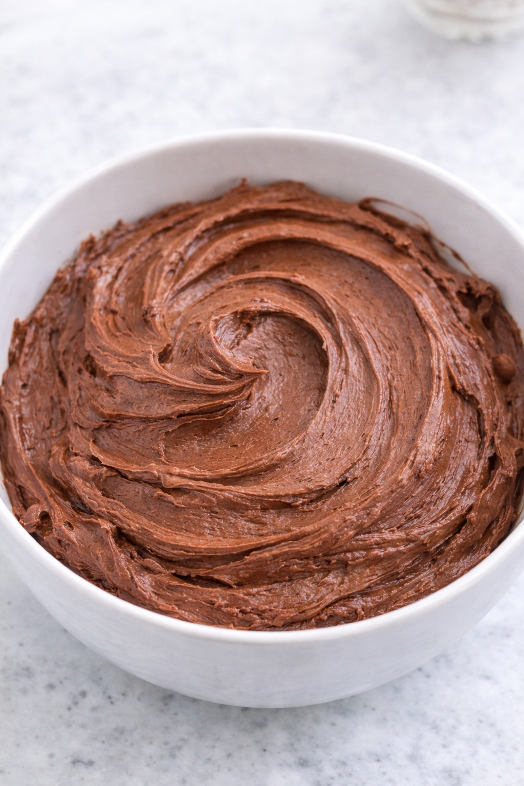 Chocolate Buttercream Frosting in a white bowl 