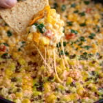 Creamy Cheesy Hot Corn Dip in a green skillet