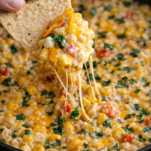 Creamy Cheesy Hot Corn Dip in a green skillet