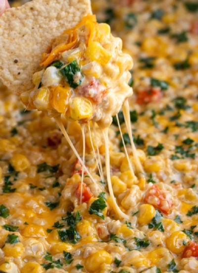 Creamy Cheesy Hot Corn Dip in a green skillet
