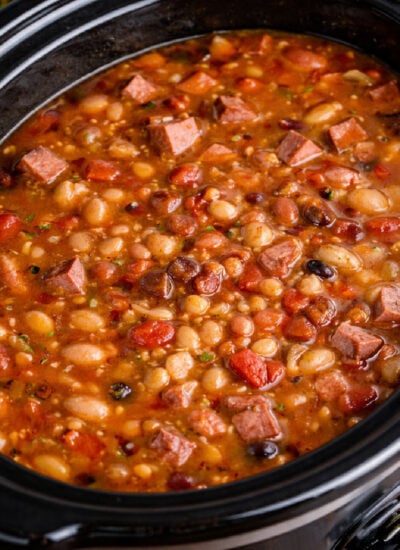 Slow Cooker Ham and bean soup in a black slow cooker m