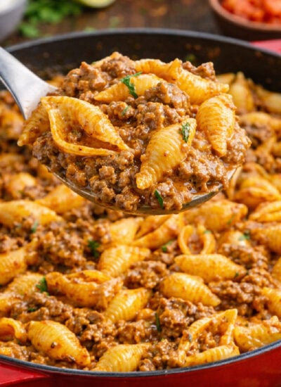 Cheesy Taco Pasta Shells in a red skillet