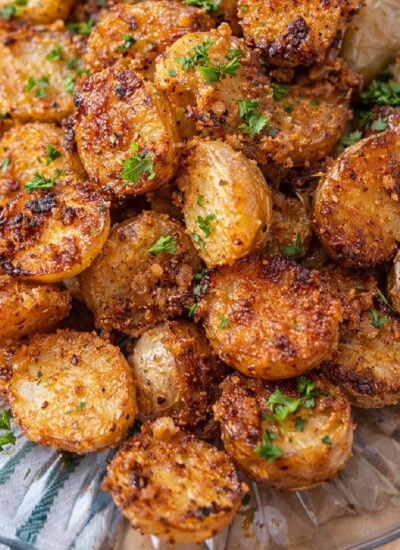 Crispy Garlic Parmesan Potatoes on a clear white plate