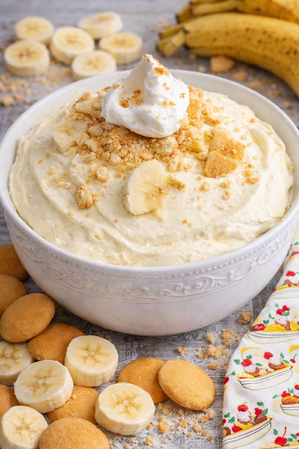 No Bake Banana Cream Pie Dip in a pretty white bowl on a wood table 