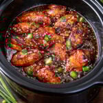 Slow Cooker Chicken Teriyaki Wings in a black slow cooker