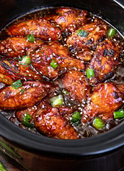 Slow Cooker Chicken Teriyaki Wings in a black slow cooker