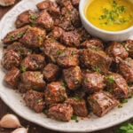 Juicy Garlic Butter Steak Bites in a skillet covered in garlic butter