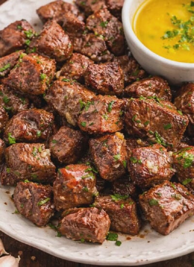 Juicy Garlic Butter Steak Bites in a skillet covered in garlic butter