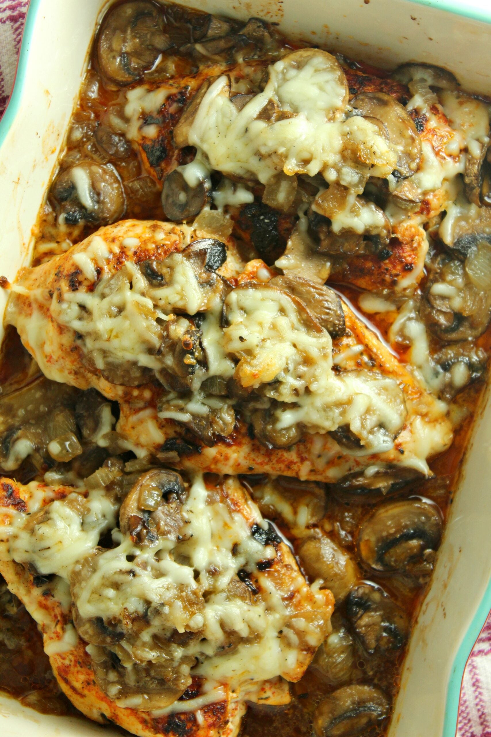 Smothered Cheesy Baked Chicken with Mushrooms