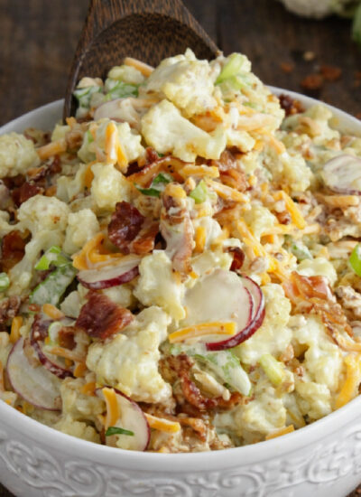 Loaded Cauliflower Salad in a pretty white bowl