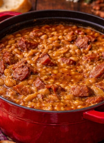 Ultimate Baked Beans with Smoked Sausage in a red pot