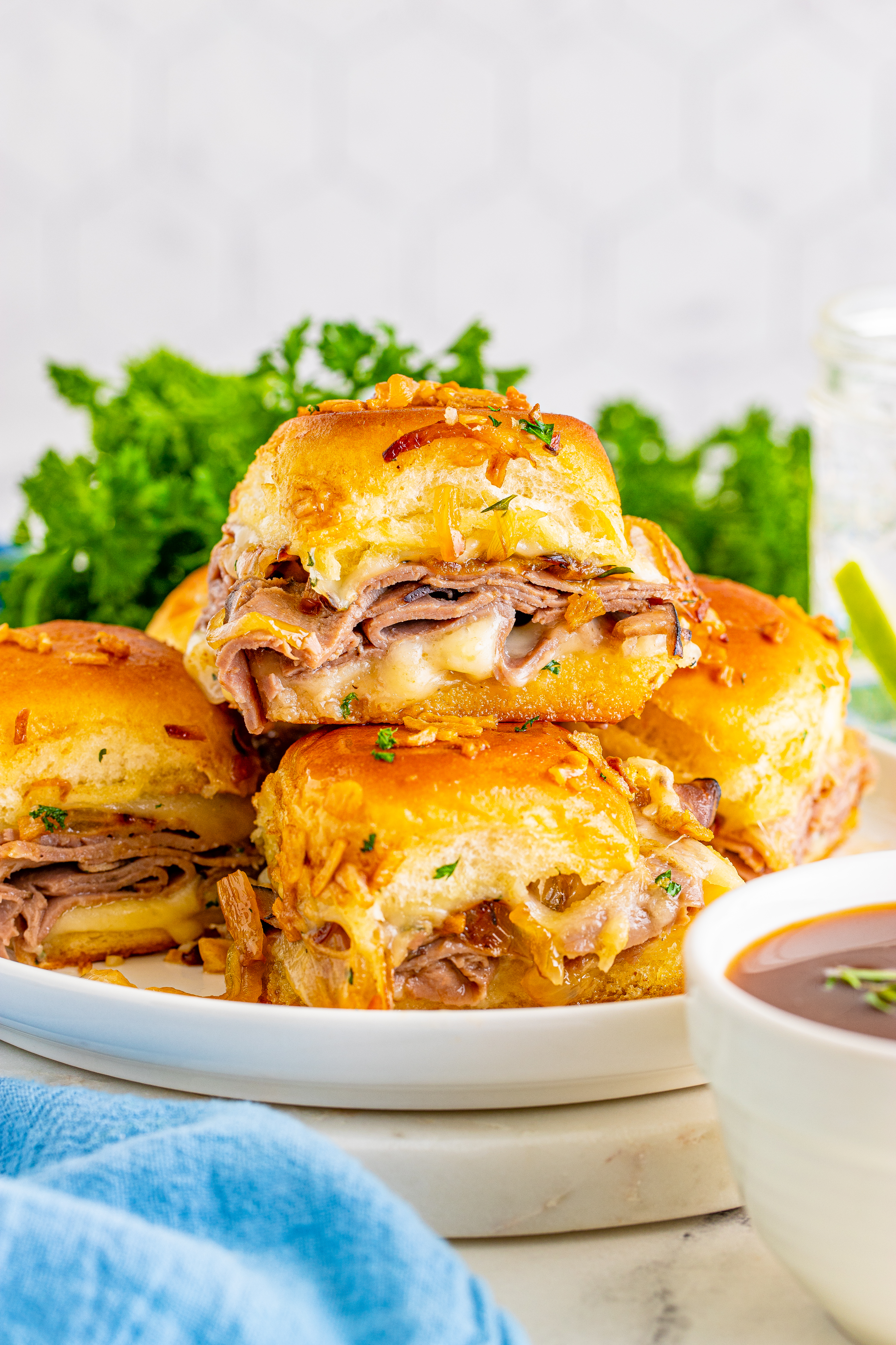 French Dip Sliders on a white plate 