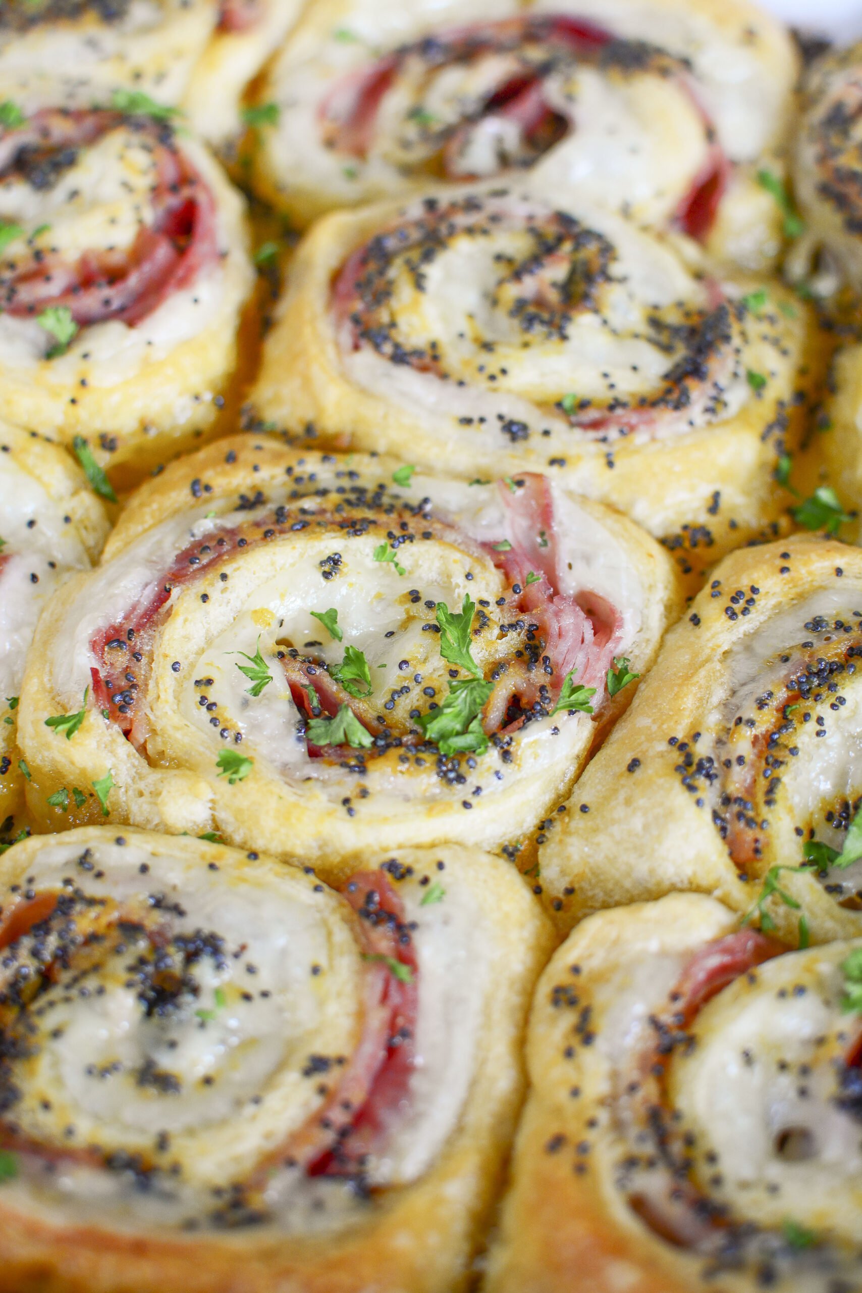 Ham and Cheese Pinwheels in a white baking dish