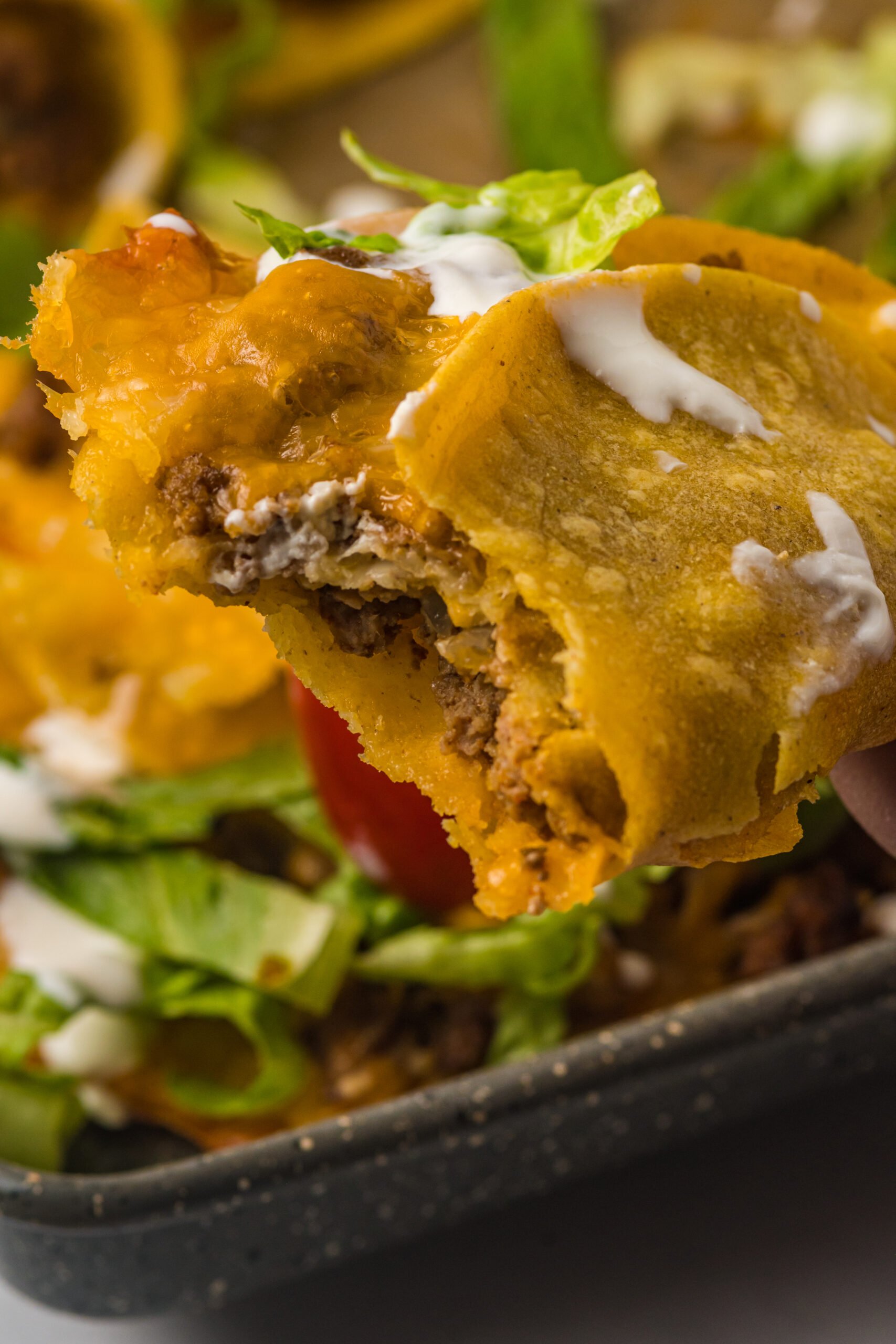 Close up view of a Beef Taco with a bite removed.