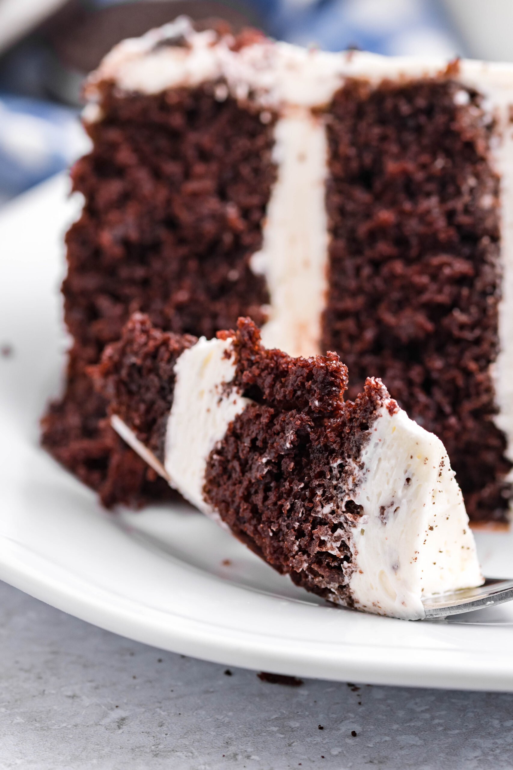 A bite of Double Stuffed Oreo Cake on a silver fork.