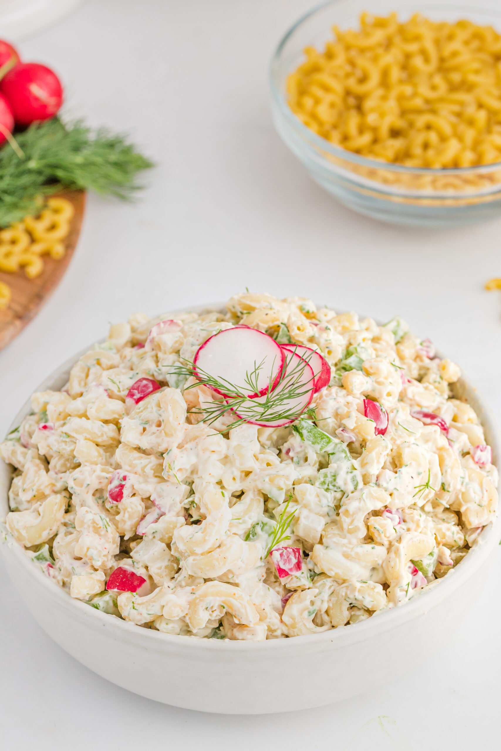 Front view of Macaroni Dill Pasta Salad in a white serving bowl.