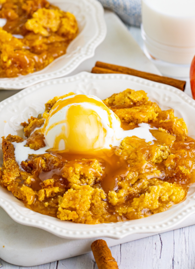 Caramel apple dump cake on a white plate
