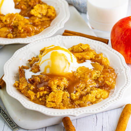 Caramel apple dump cake on a white plate
