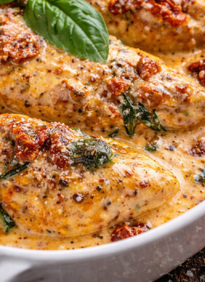 Marry me chicken in a white baking dish up close