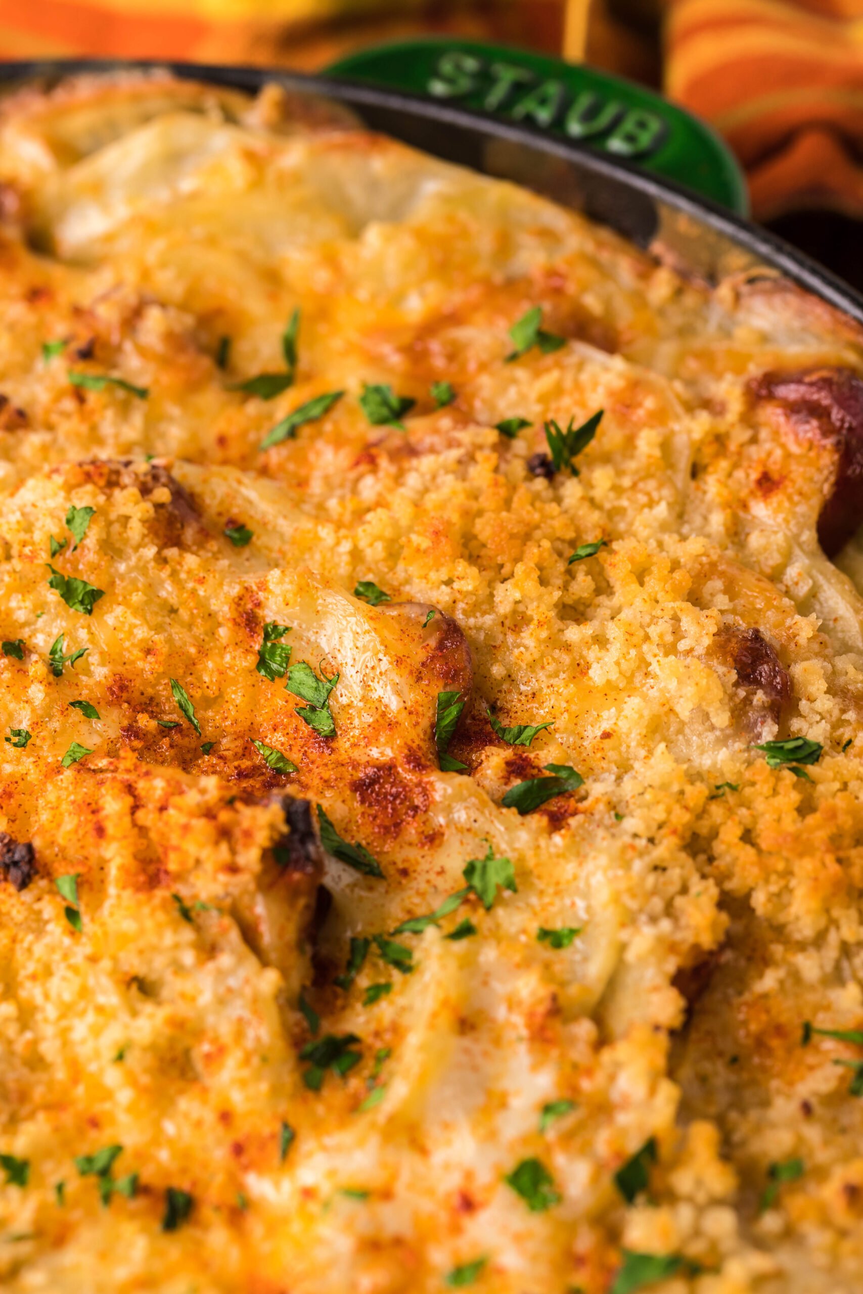 Close up view of Au Gratin Potatoes & Ham in a cast iron skillet.