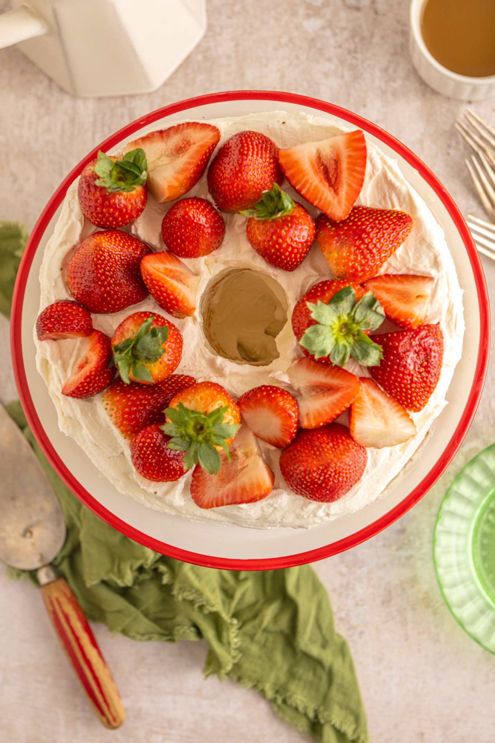 overhead view of the Strawberry Angel Food Cake topped with fresh strawberries. 