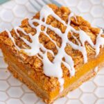 Pumpkin Streusel Bar sliced on a white plate