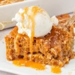 sliced earthquake cake on plate drizzled with caramel and a scoop of ice cream