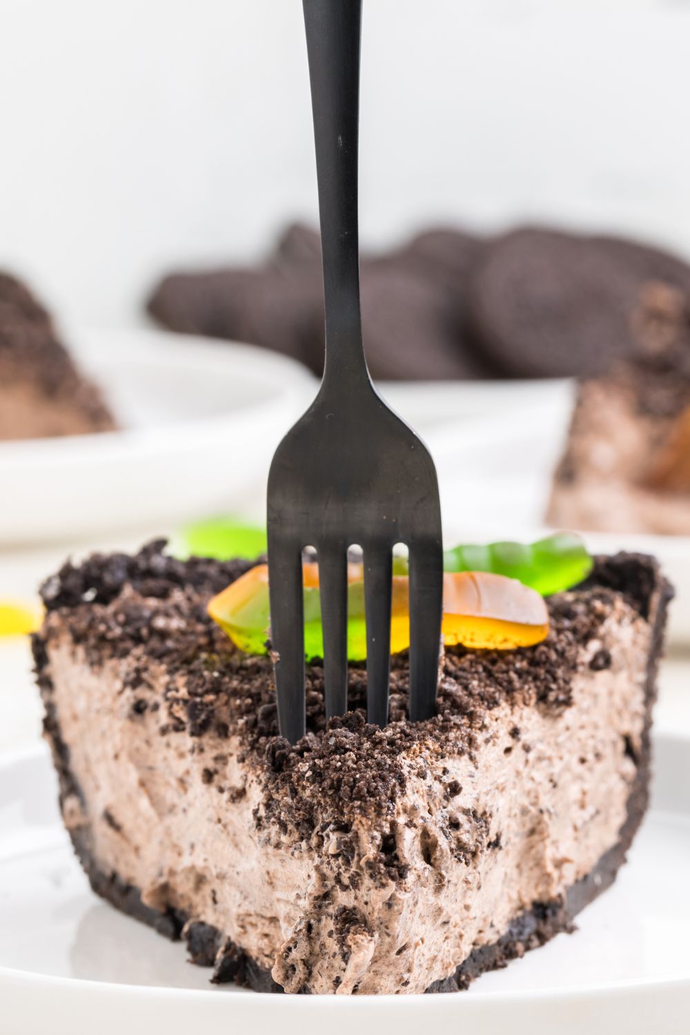 oreo dirt pie sliced on a plate