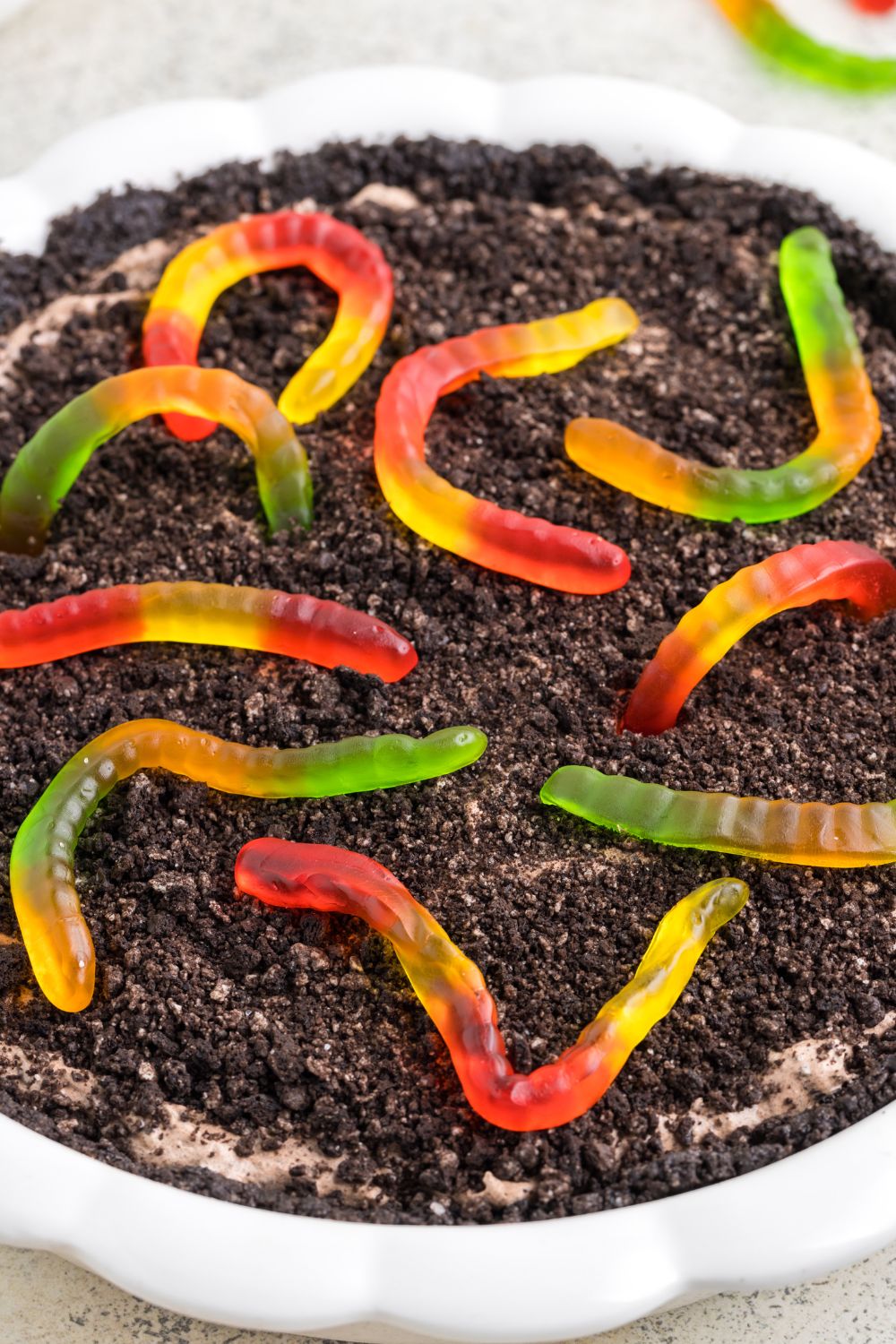 overhead shot of mud pie with gummy worms on top