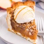 Apple Crumble Cheesecake slice of pie on plate with ice cream on top
