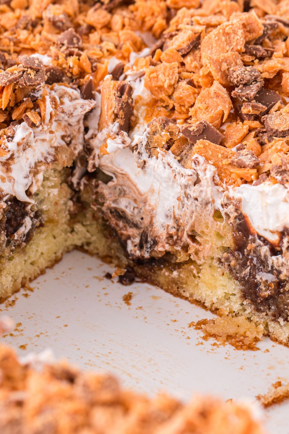 butterfinger delight in pan with a few slices removed