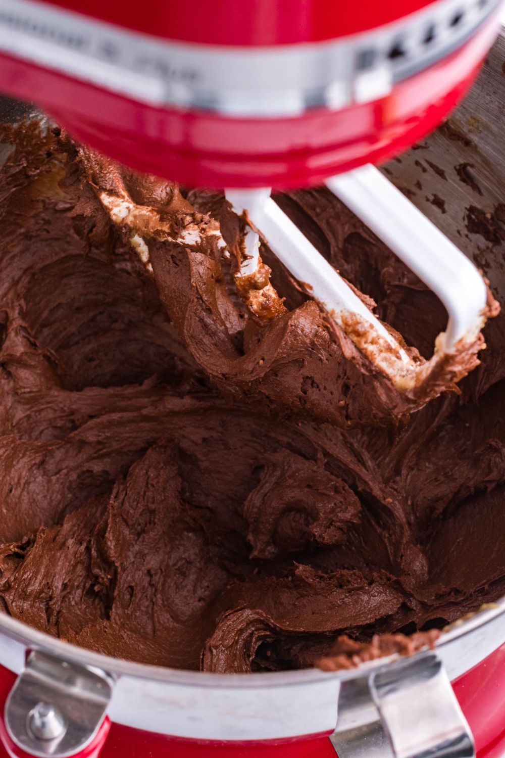 stand mixer with chocolate cookie dough batter in it 