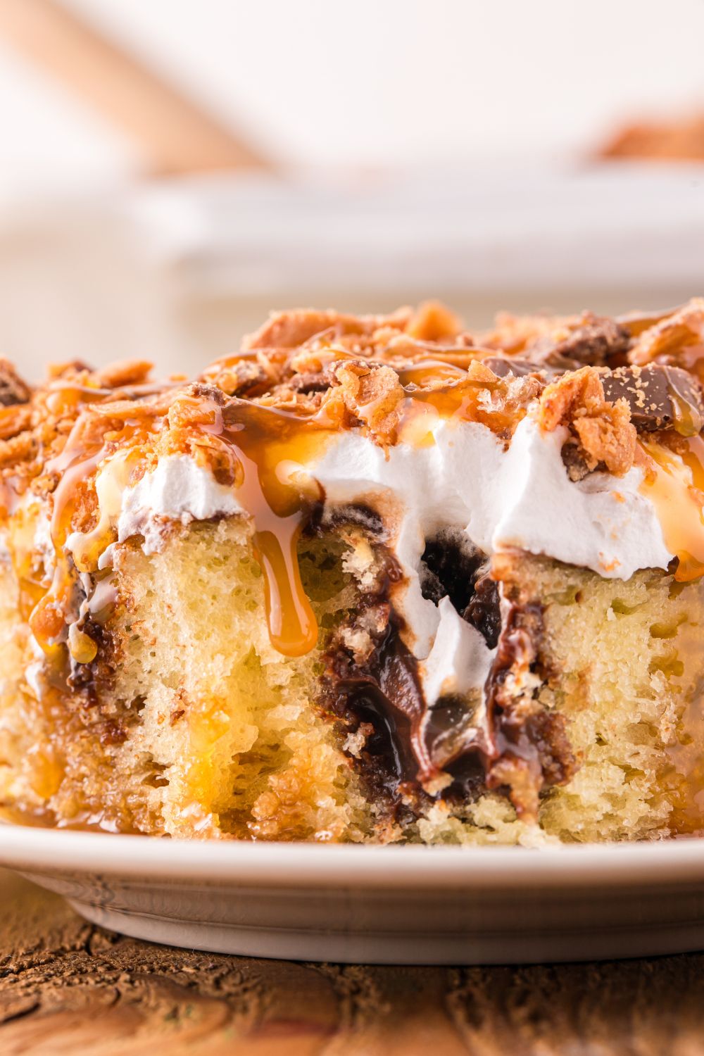 slice of cake on plate with a bite taken out