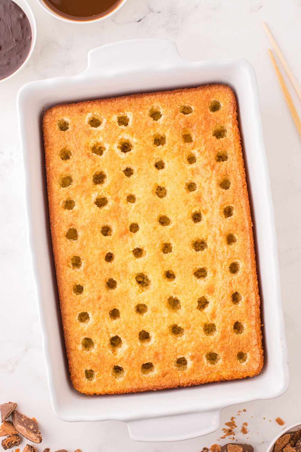 holes poked all over cake 