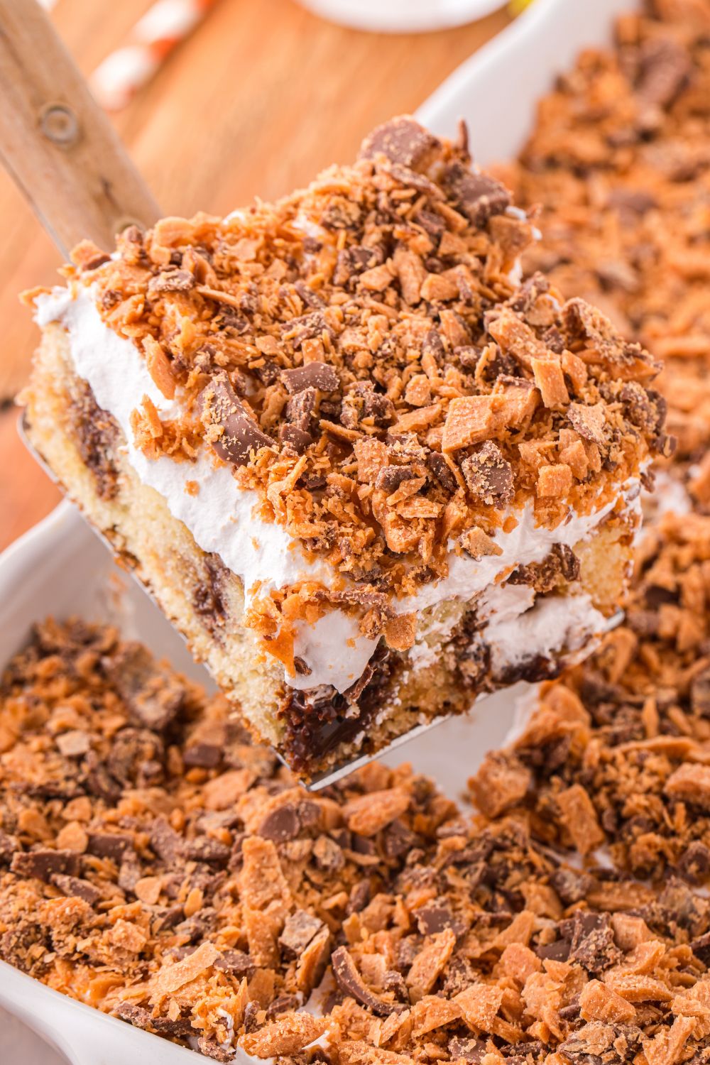 slice of cake on spatula above pan