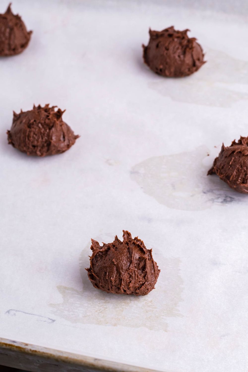 chocolate cookie dough on a baking tray 