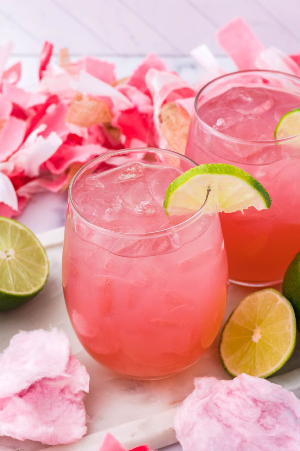 glasses with a sweet cocktail on top of it 
