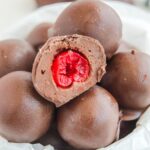 Cherry Brownie Bombs in bowl with one cut in half