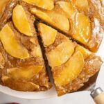 Apple Upside Down Cake with a slice being lifted up