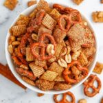 Churro Chex Mix in a bowl on marble counter