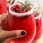 Mistletoe Margarita in glass being held in the hand