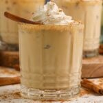 pumpkin white russian cocktail in a glass on table