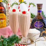 Drunk Rudolph Milkshakes on table with alcohol behind glasses