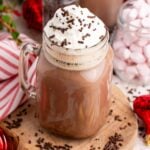 Dirty Snowman in a mason jar with a handle with whipped cream and sprinkles on top