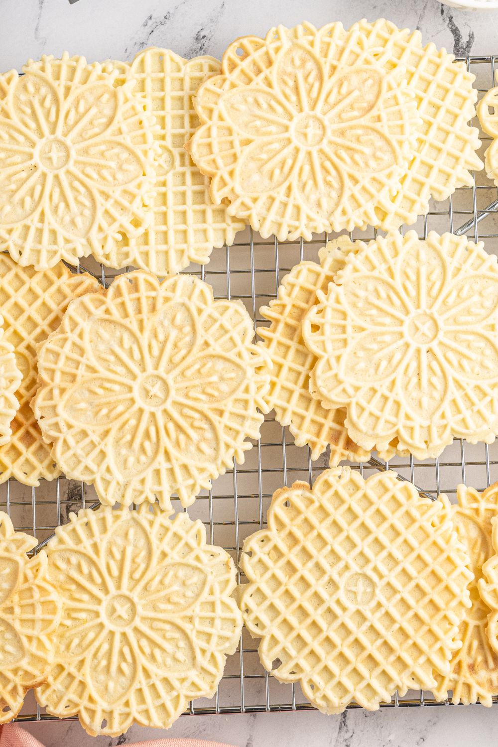 pizzelle cookies on a cooling rack