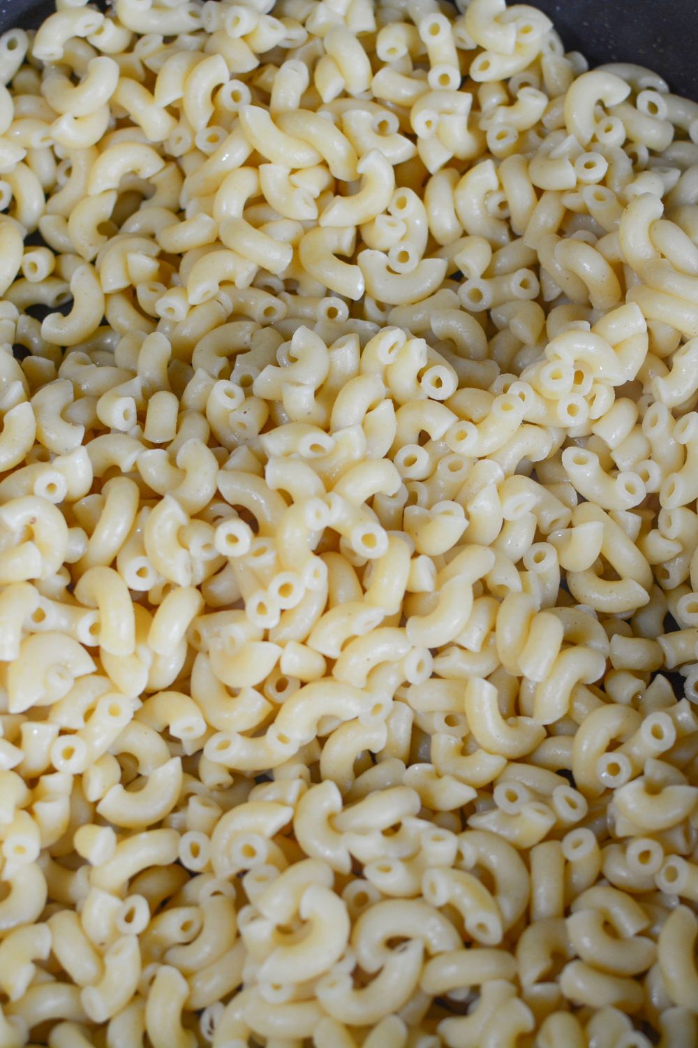 cooked pasta in a bowl on table - Big Mac Macaroni And Cheese