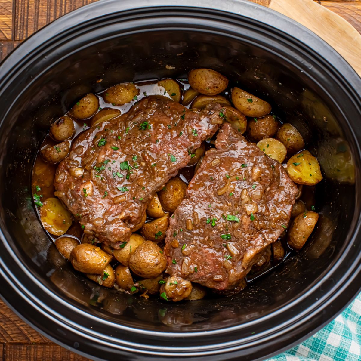 Crock Pot Steak and Potatoes in a crock pot on table 