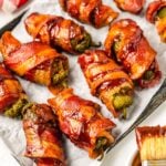 Texas Twinkies on a baking sheet with a bbq brush sitting on the side